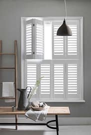 1- Tracked _ Bi-Fold tracked bifold shutter by shaded interior